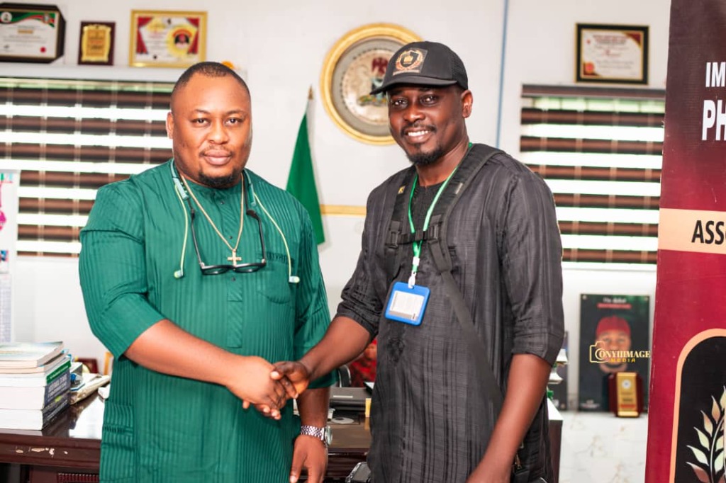 Executive Chairman of Owerri Municipal Local Government Area, Hon. Chidiebere Emereibe (left), in a handshake with ISPPAN Imo State Chapter President, Comrd. Onyeahialam Chibueze T. (right), during the courtesy visit at the Municipal Council Headquarters in Owerri.