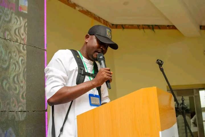 ISPPAN President Comrd. Onyeahialam Chibueze T. addressing participants and guests from the podium during the World Photography Day 2026 celebration.